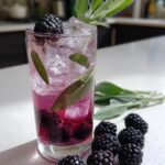Blackberry Sage Fizz Mocktail – Rich blackberries and aromatic sage paired with citrus and bubbles.