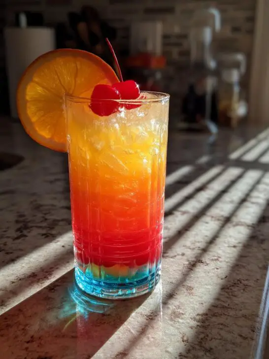 Colorful Rum Punch Cocktail with Tropical Fruit Juices