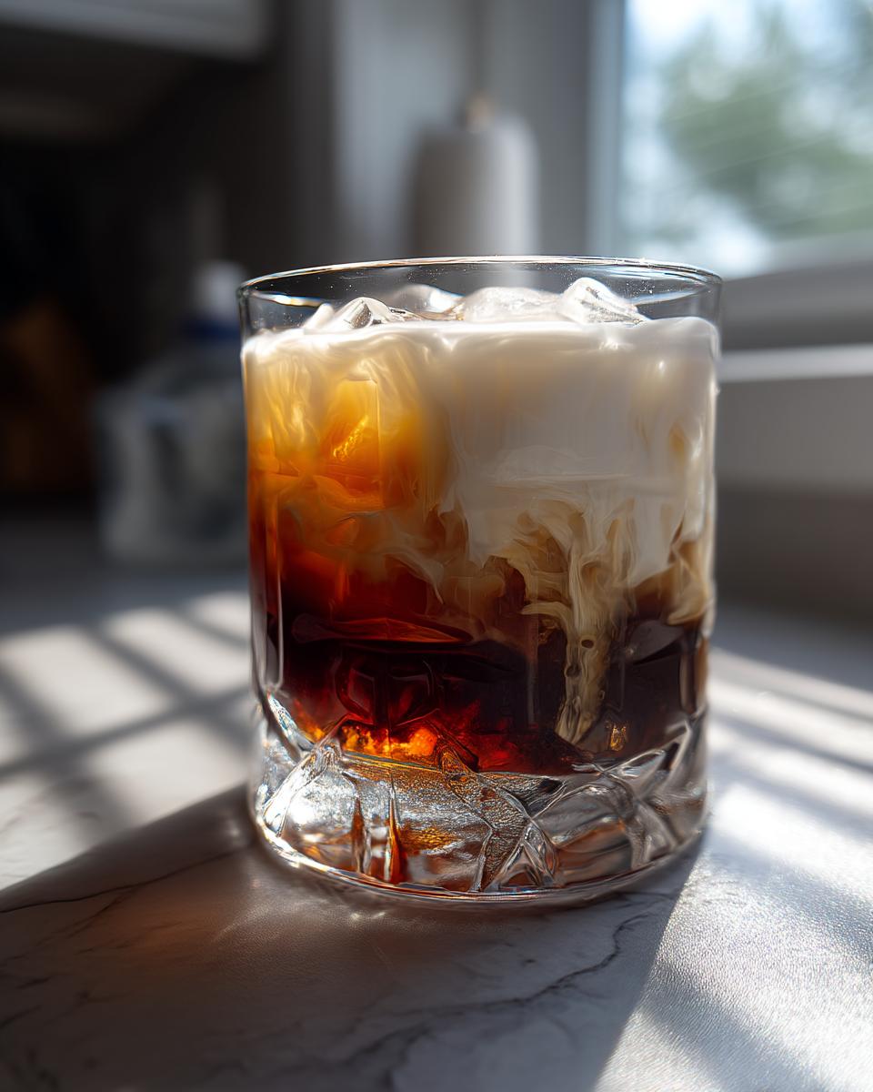 Creamy White Russian Cocktail with Vodka and Coffee Cream - detail 1
