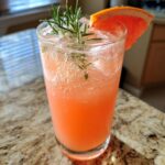 Grapefruit Rosemary Fizz Mocktail – Tangy grapefruit juice infused with rosemary and soda bubbles.