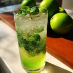 Green Apple Mint Mocktail – Tart green apple juice balanced with fresh mint and soda.