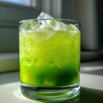 Kiwi Cucumber Sparkle Mocktail – Refreshing kiwi and cucumber juice over ice with lemon soda.