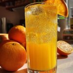 Mango Tango Citrus Mocktail – Mango and orange juices shaken together with lime and a fizzy finish.