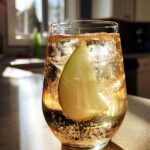 Pear Vanilla Sparkler Mocktail – Juicy pear juice and vanilla syrup with a fizzy soda top.