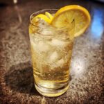 A refreshing Best St Germain Cocktail served over ice with a lemon slice and twist garnish.