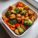 Close-up of a portion of chicken and vegetable stir-fry, perfect for Meal Prep Family Of 4.